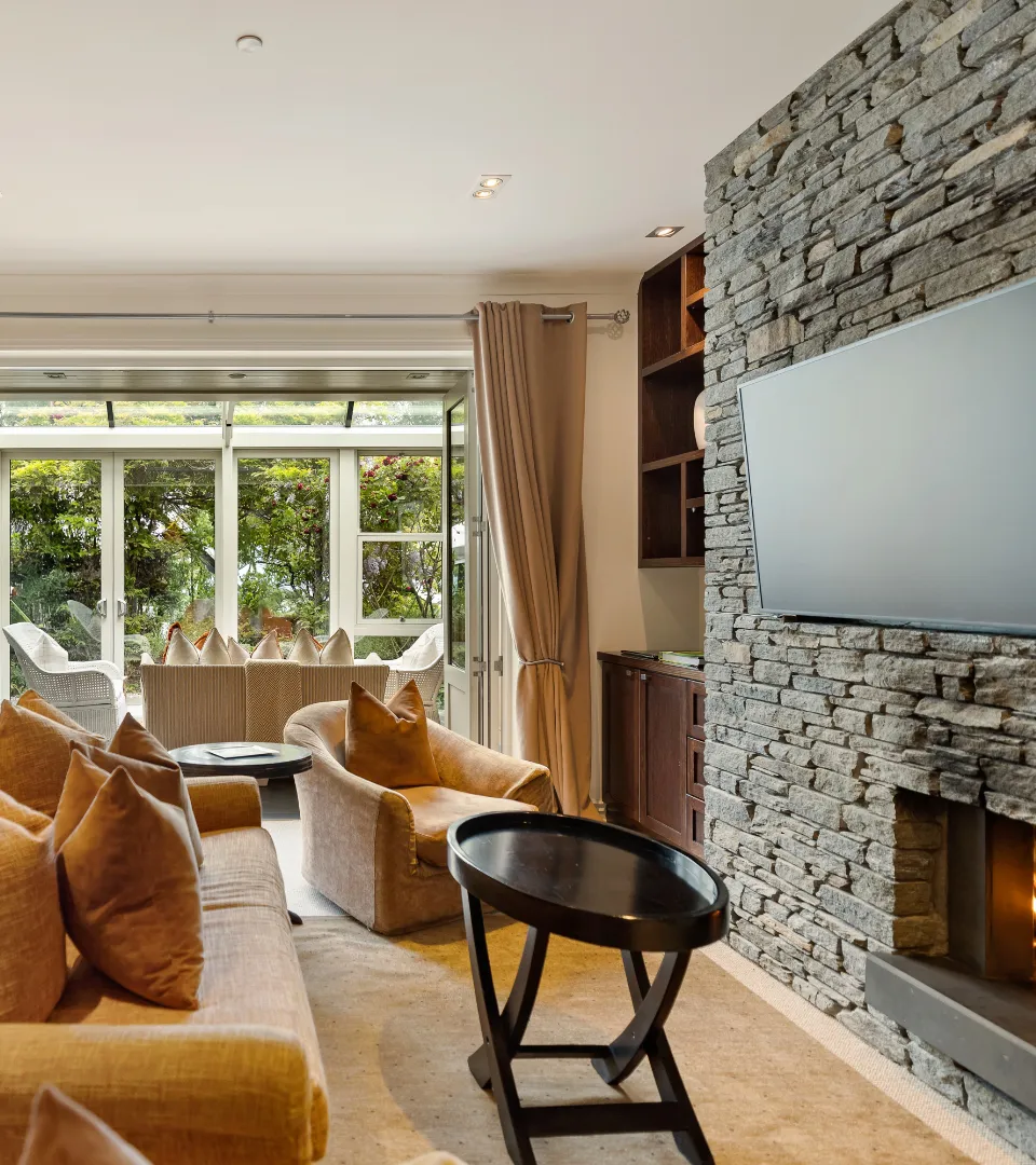 Modern lounge at Balmoral Luxury Apartments with lake and mountain views