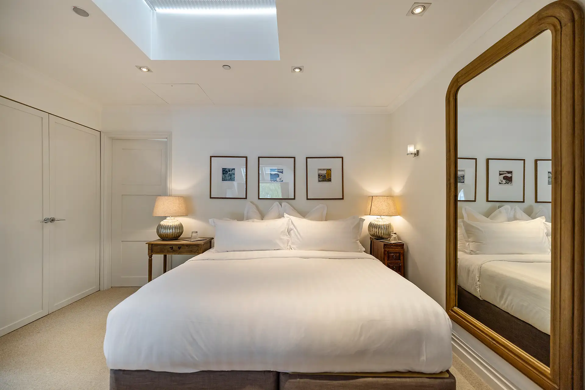 Creighton master bedroom with neutral tones and mountain views